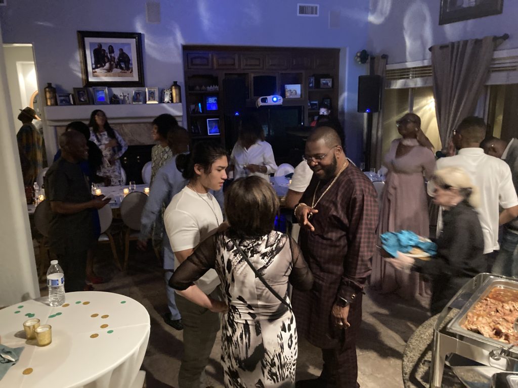 How to host a covid friendly event
Gathering of multicultural and multi generational people in the family room dancing and celebrating the birthday boy.