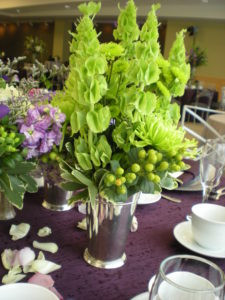 St. Patrick's Day Wedding Irish Theme
Silver vase with bells of Ireland inside the vase.